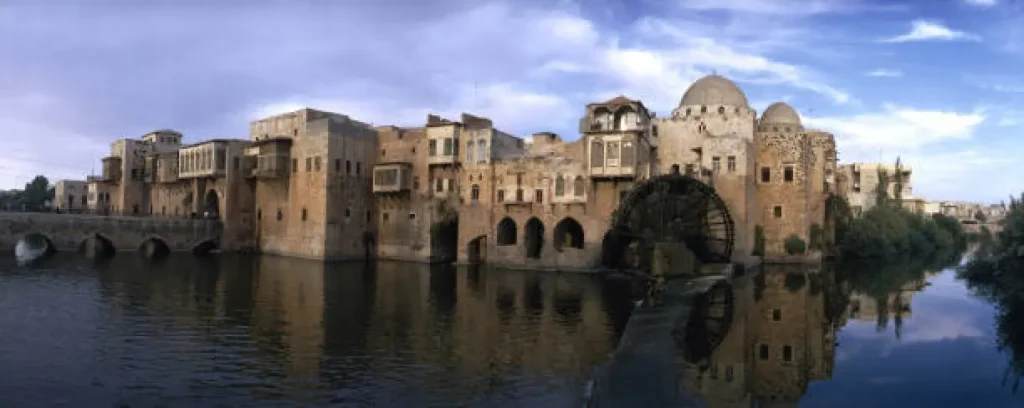 صورة قديمة لناعورة الكيلانية وحي الكيلانية المدمر